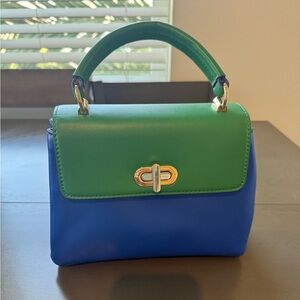 Blue and green crossbody bag with adjustable straps